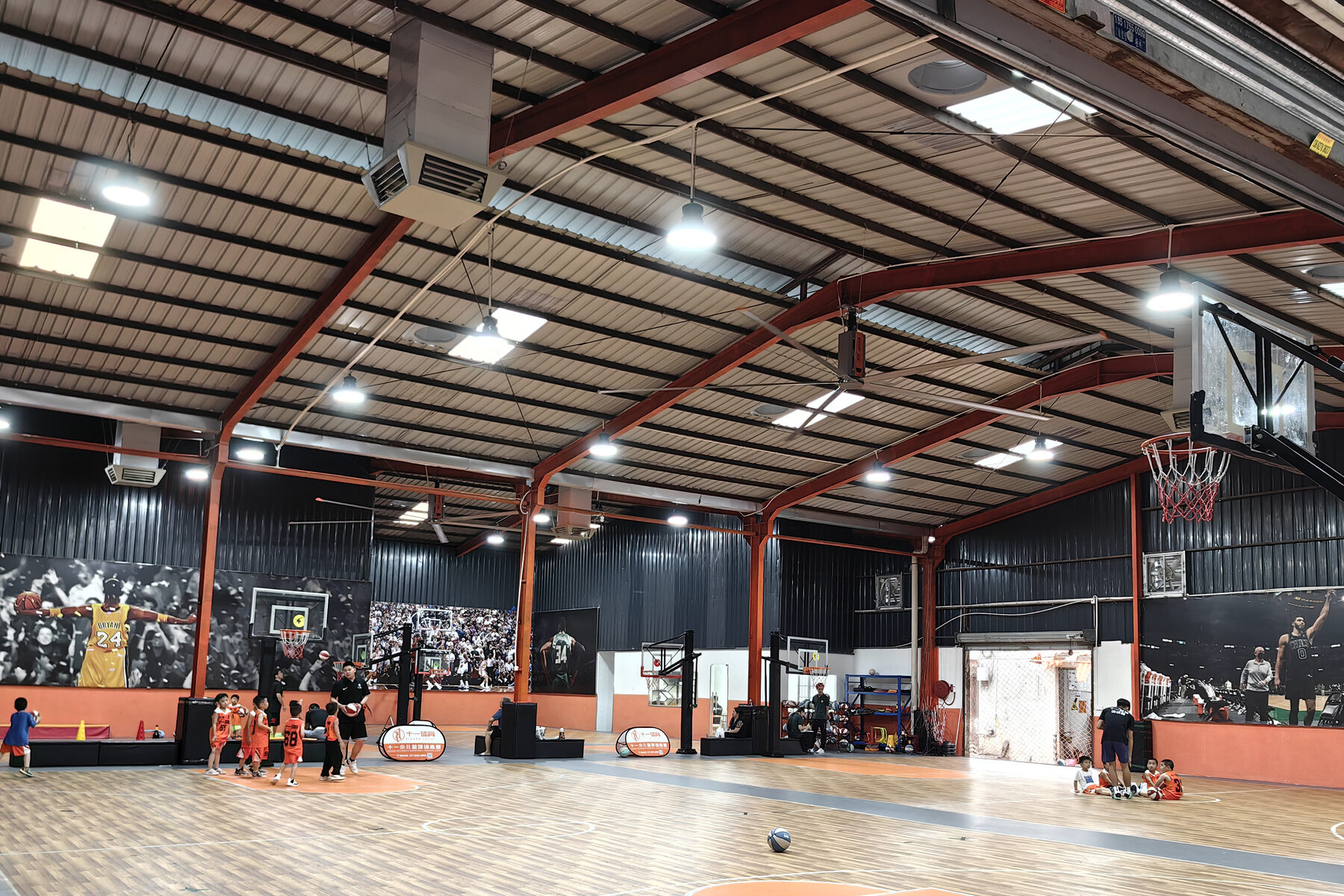 RTFANS HVLS fans and evaporative air coolers installed in an indoor sports facility